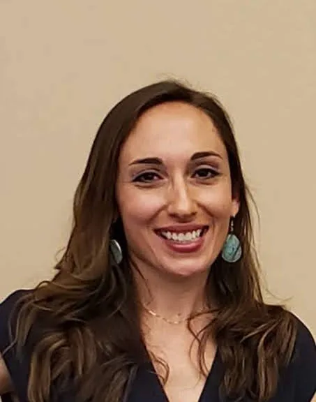 Headshot of Melissa Sinclair, BSN, RN, smiling against a neutral background